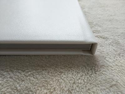 China Homemade Flat Spine 11x11 White Leather Bound Photo Album Waterproof Pages for sale