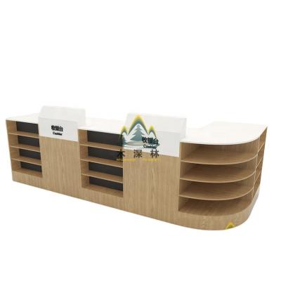 China Environmental Friendly Supermarket Island Display Rack Cashier Counter With Storage Cabinet Perfect For Candy And Snacks Sales And Promotion for sale