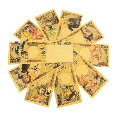 China PVC Plastic Japan Anime One-Piece Gold Foil Banknote Monkey Luffy Nami Zoro Souvenir Props Money Commemorative Banknote Gifts for Friends for sale