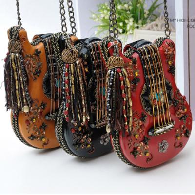 China Fashion Unique Angel Kiss Shoulder Bags Ladies Tassel Sling Bag Beaded Evening Clutch Bags For Women Luxury for sale