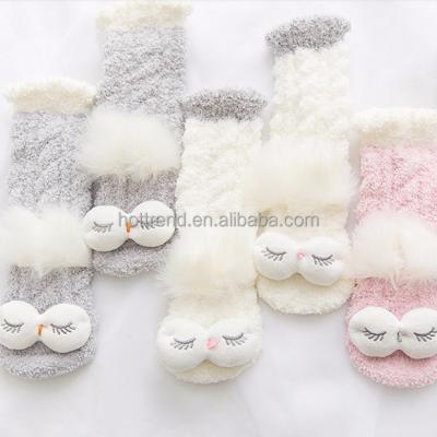 China 98%polyester 2%spandex woman ladies new micro comfortable cable knitted home slipper socks with big eyes pom for sale