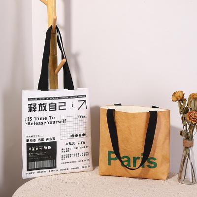 China Dupont new custom LOGO eco-friendly reusable retro fashion wear-resisting washable reusable handheld waterproof paper bag for sale