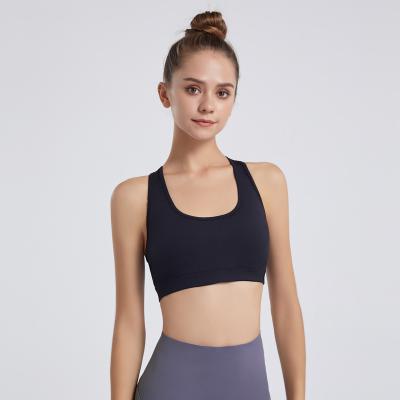 China Pretty Breathable Hallow Back Design New Yoga Tops Wear Vest Elasticity Fitness Training Gym Activewear Slim Yoga Sports Bras for sale