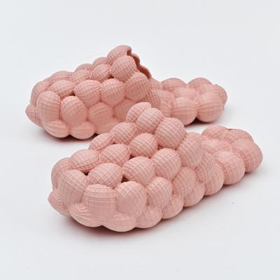 China Cushioning Customized EVA Pink Massage Air Bubble Slippers Wholesale Litchi Bubble Bottom Slide Slippers New Summer Fashion Unisex for sale