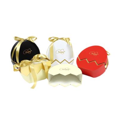 China Disposable Eggshell Shaped Paper Box Breaking New Flower Gift Box With Gold Ribbon for sale