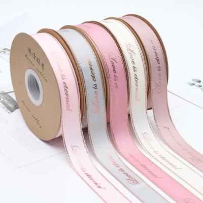 China Soft Hot Selling 2.5CM*25Y Polyester Ribbon Roll Pure Color Grosgrain Ribbon With Gold Stamping Printed for sale