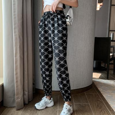 China 2022 new Anti-wrinkle ladies printed casual pants spring high waist thin section loose nine points and thin harem pants for sale