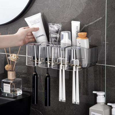 China Wall Mount Toothpaste Dispenser Toothbrush Holder Storage Squeezer Self Adhesive Razor Holder for sale