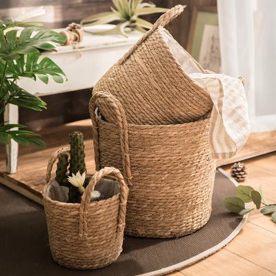 China Viable Seaweed Woven Storage Flower Basket Universal Straw Woven Flower Basket Portable Sundries Storage Basket for sale