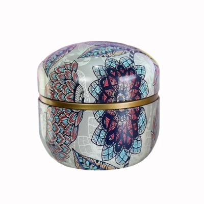 China Food custom empty small glossy painting tin cans food grade metal tin can round small  flower pattern set scented tea tin box for sale