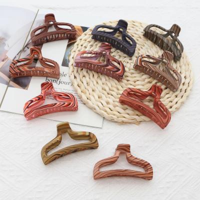 China New Multi Color Style Hollow Plastic Hair Claw Clips Model Woom Hair Clamp Accessories For Women for sale