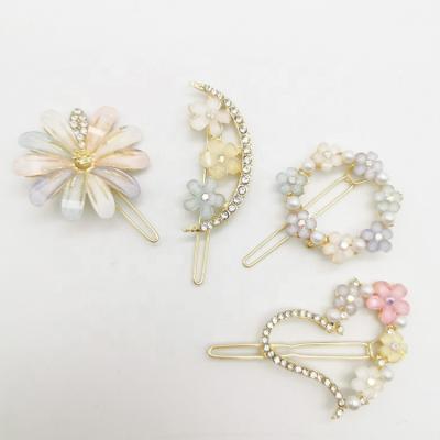 China 2022 New 4PCS Fashion Elegant Rhinestone Flower Hair Clips Bangs Hairpins Set For Girls for sale