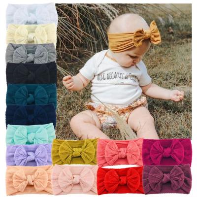 China Knitted fabric bands baby headbands for girls fashion simple solid color jacquard fabric knitted headband for kids bow elastic baby headbands for sale