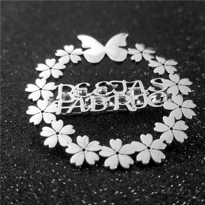 China Large Stainless Steel Personal Vintage Butterfly Flower Logo Name Brooch Women Accessories Custom Made for sale