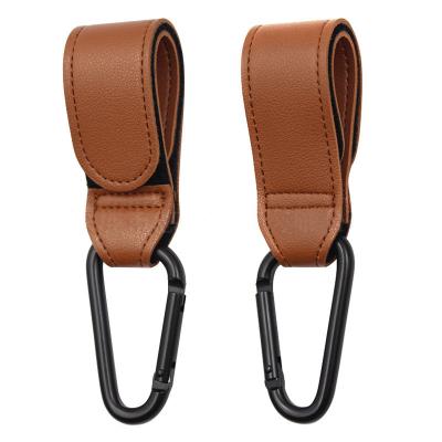 China PU Thickened Environmental Leather With Magic Buckle High Quality Leather Hook For Hanging Baby Stroller Metal Pram Stroller Hanger Leather for sale