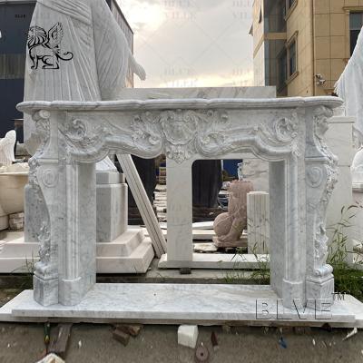 China White Carrara Marble Fireplace Surround Luxury French Style Stone Mantel Indoor Decorative Hand Caved for sale