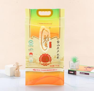 China Food Grade 5kg 10kg Agriculture Mylar Moisture Proof Custom Stand Packaging Rice Bags With Punch Hole Handle for sale