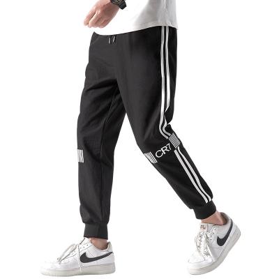 China Autumn And Winter Loose Brand spring trend Korean sports foot Anti-wrinkle men's casual long pants nine point pants for sale