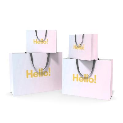 China High Quality Recycled Materials Gift Bag Christmas Packaging Craft Shopping Cardboard Paper Bag With Logo for sale