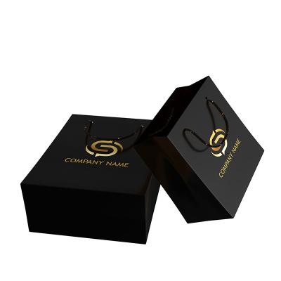 China Recycled Materials Custom Luxury Gift Bags Black Gift Packaging Bag Clothing Cosmetics Packaging Gift Bags With Gold Logo for sale