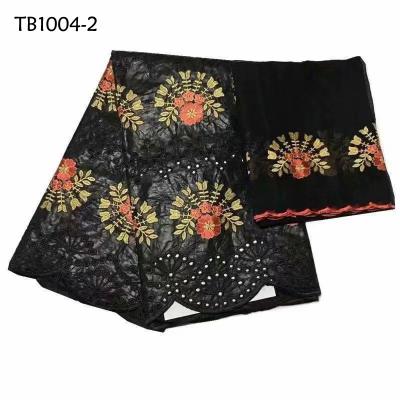 China Anti-static Black Color Flower Design Stones Embroidered Bazin Riche With Tulle Lace Fabric for sale