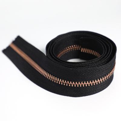 China Customized Reversible Long Lasting 5# Length Gold Metal Reversible Zippers For Clothing for sale