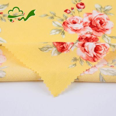 China Beautiful factory viable supply flower plain printed viscous rayon fabric yellow woven super soft for summer dress for sale