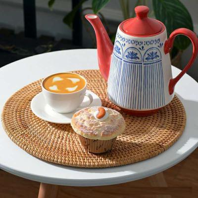 China Sustainable Wholesale Handmade Woven Heat Insulation Rattan Place Mat For Kitchen for sale