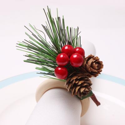 China Christmas table ornaments pine cone napkin ring bell cedar napkin loop stocked wooden napkin ring for sale