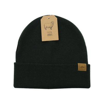 China Good Quality Wool Knitted Beanie COMMON Hot Selling Hat With Cuff Double Layer With Foldable Suede Leather Patch for sale