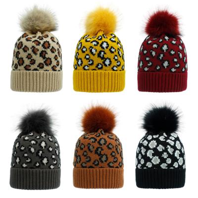 China COMMON Wholesale Custom Ribbed Jacquard Knitted Leopard Spotted Print Pattern Pom Beanie Hat Toque Snow Skull With Faux Fur Pompom for sale