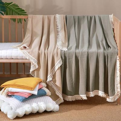 China Wholesale Anti-static Cotton Muslin Pleat Solid Color Newborn Infant Fringe Wrap Bath Towel Baby Wrap Blanket With Tassel Trim for sale