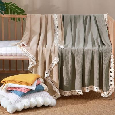 China 2022 New Arrival Solid Color Cotton Muslin Tassel Blanket Anti-static Organic Bamboo Bamboo Fringe Wraps for sale