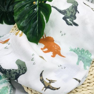 China PORTABLE Wholesale Custom Print Cotton Comforter Dinosaurs Bamboo Wrap Muslin Baby Kid Wrap Covering for sale