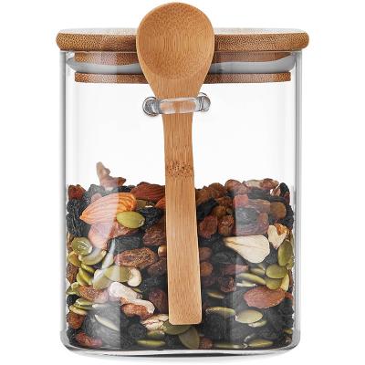 China Freshness Preservation Kitchen Nuts Spices Canisters Bamboo Lids Moisture Proof Food Storage Jar With Spoon Use Clear Glass For Home Custom Gifts for sale