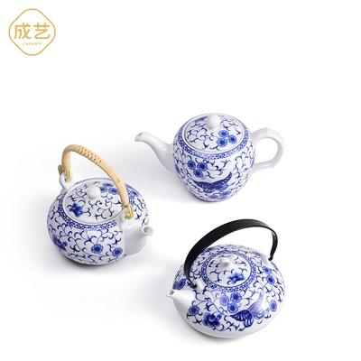 China Sustainable Ceramic Stainless Steel Strainer Infuser Blue And White Teapot for sale