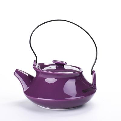 China Sustainable Ready To Ship Purple Color Glazed Ceramic Teapot With Stainless Steel Infuser And Metal Handle for sale