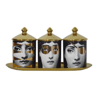 China Home Decorative Ceramic Storage Jar Gold Ornaments Human Face Decoration Scented Candle Jar for sale