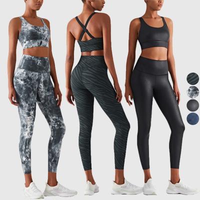 China WX1419 CK1416 Cross Bra Tie Antibacterial High Quality Back Adjustable Dye Leggings Two Piece Yoga Gym Set Women Fitness Clothing Yoga Set for sale