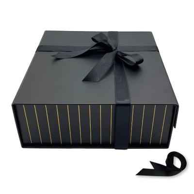 China Gift & Chic Style Felt Customizable Craft Folding Box Elegant And Simple And Long Ribbon Matte Black Magnetic Gift Paper Box for sale