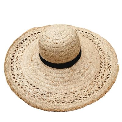 China Summer Floppy Hats Black Ribbon Raffia Hat Hollow Flower Style Large Brim Sun Designer Dome Designer Hats For Women Straw Beach Hat for sale