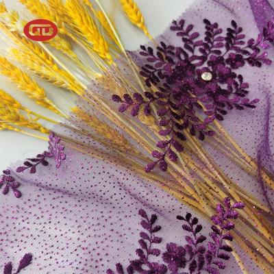 China New Viable Purple Flower Stone Glitter Mesh Embroidery Lace Fabric for sale