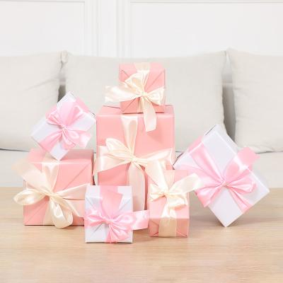 China Recyclable Custom Christmas Gift Wrapping Paper Style Cardboard Backing Packaging Boxes With Ribbon for sale