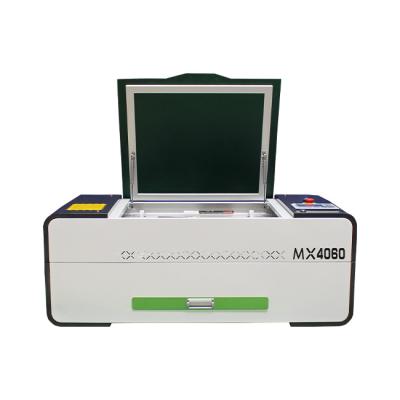 China Mingxing Mini Laser CO2 Laser Cutting Machine 4060 Water Cooled Laser Cutting Machine 70W 90W for sale