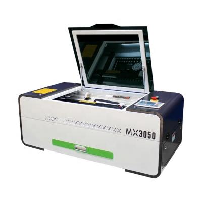 China Ultra-fast traceability MingXing laser CO2 lazer cutter 70w 90w 3050 4060 and high efficiency laser engraving machine for sale