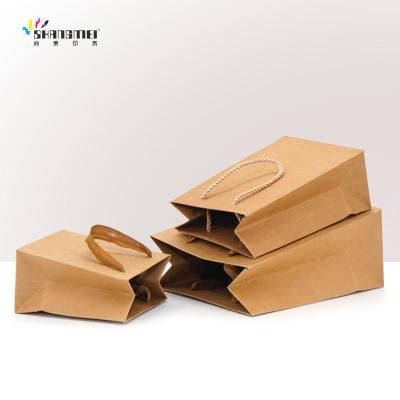 China Recycled Materials China Manufacturer Custom Brown Paper Bag Shopping Gift Paper Bags With Your Own Logo for sale