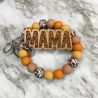 China FASHIONABLE Western MOM Engraved Tag Cow Print Cow Print Key Chain Women Key Chain Bracelet Brown Cow Print Key Chain for sale