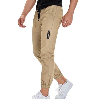 China Best Selling Flat Plus Size Midweight Pockets With Button Work Cargo Drawstring Pants For Men for sale