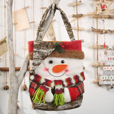 China Cheap Tree Decortaion 3D Snowman Doll Handbag Christmas Candy Gift Bags For Kids for sale