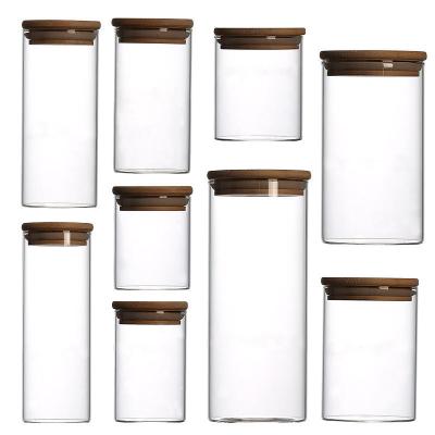 China Sustainable Borosilicate Glass Storage Jar With Bamboo Lid For Tube Shaped Storage Glass Jar For Glass Spice Jar for sale